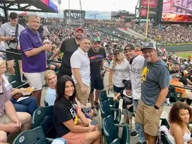 Ferris State supporters seated together at a baseball game