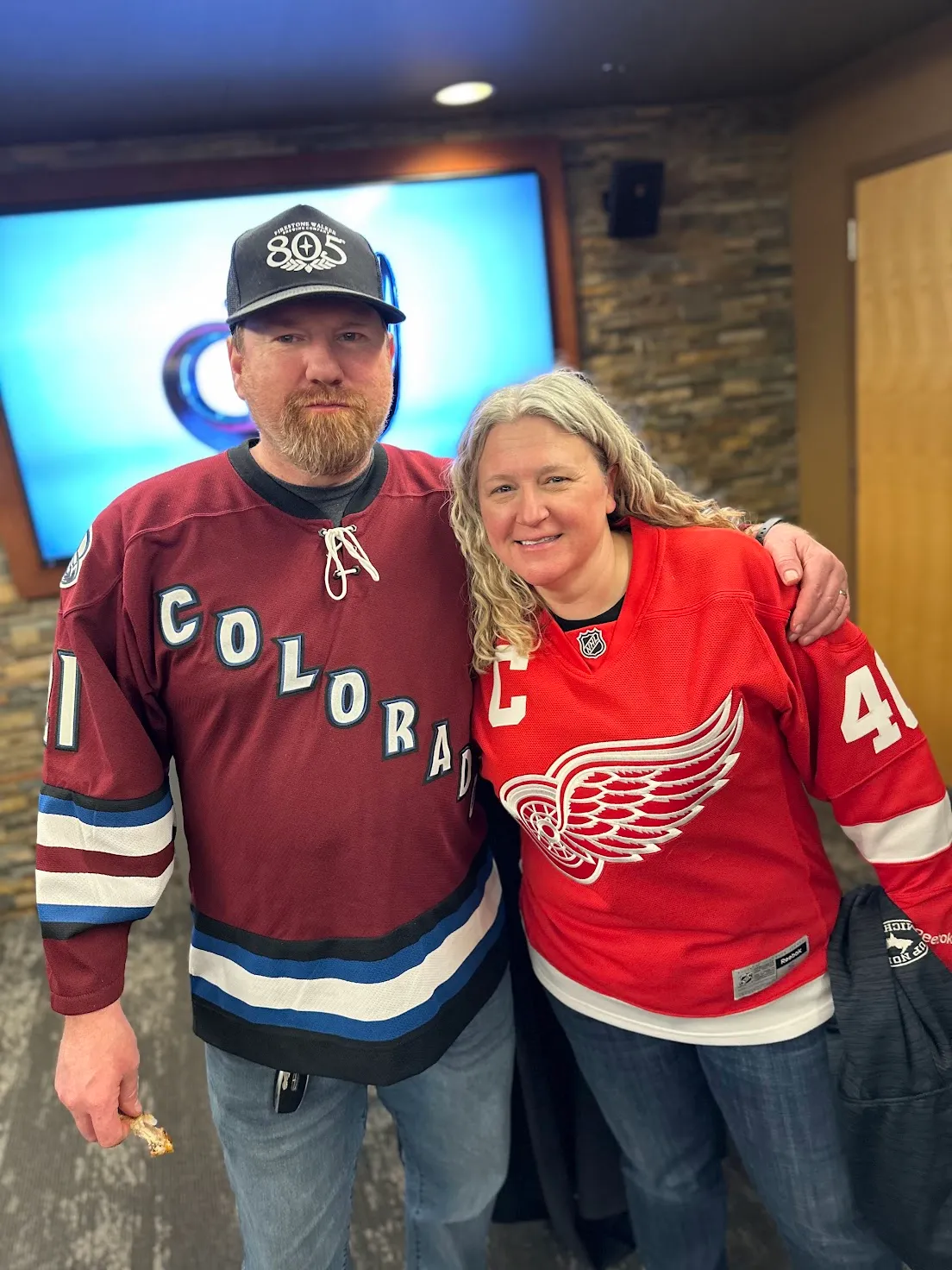 Colorado Avalanche and Detroit Red Wings fans together at a Mile High Bulldogs gathering