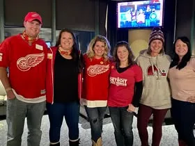Group of Detroit hockey supporters gathered indoors